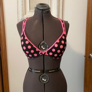 Racer back hot pink and black polkadot bra.